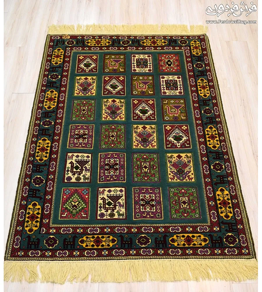 Green hand-woven clay carpet rug with intricate Mashhad texture, perfect for adding elegance and warmth to home interiors.