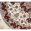 Handmade rug with circular design from Tabriz, Iran; intricate patterns, high-quality craftsmanship, perfect for home decor.